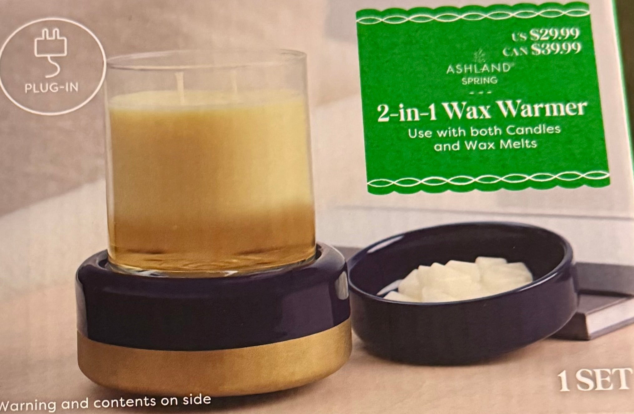 Wax warmer with a candle and wax melts, Ashland Spring brand packaging in the background.