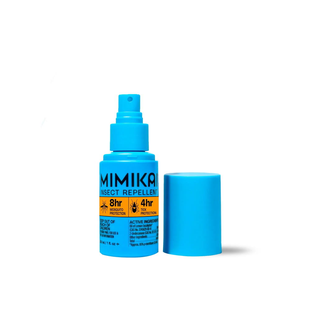 plant powered bug spray blue bottle on white background