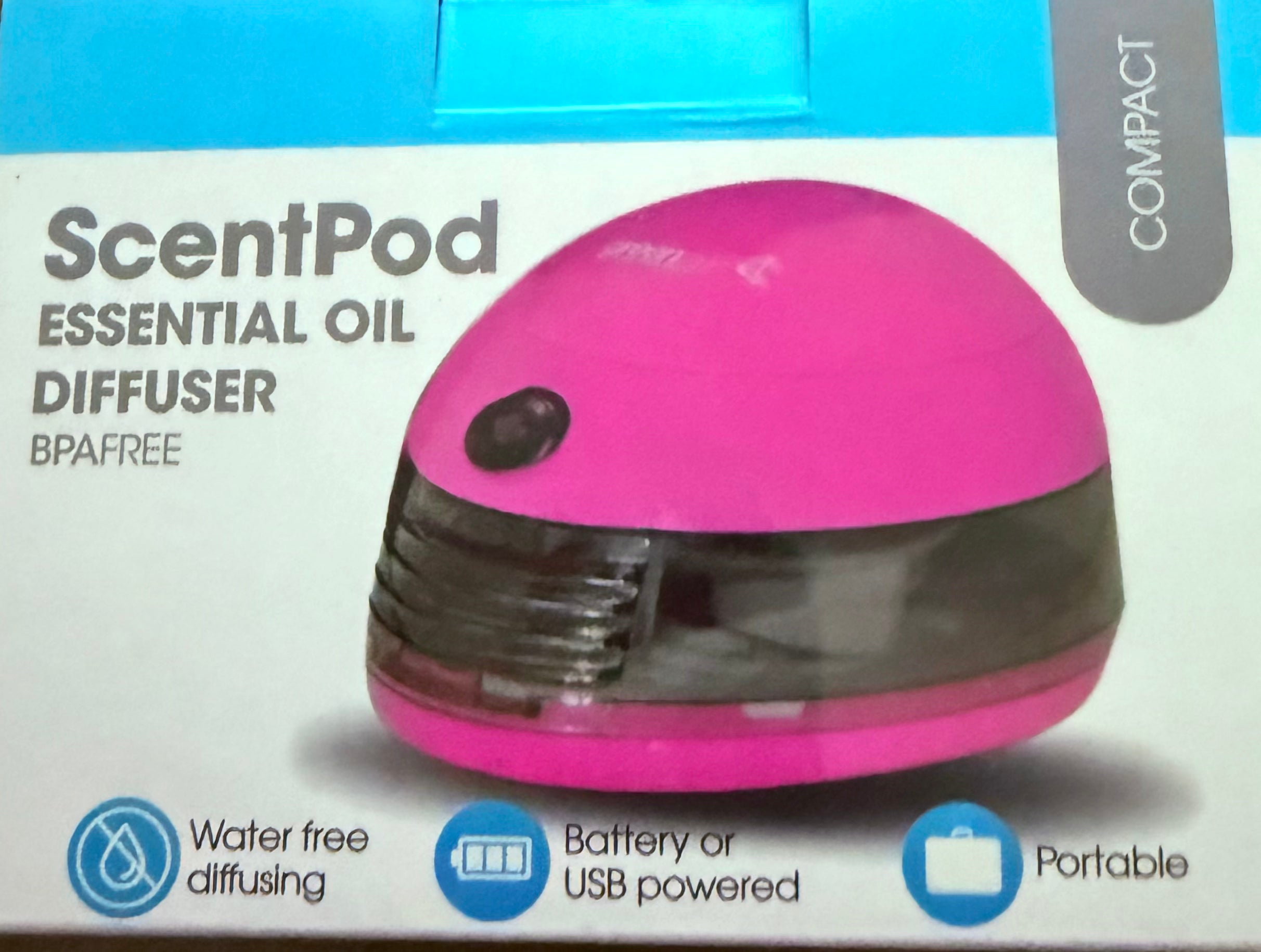 box showing portable scent pod pink essential oil diffuser