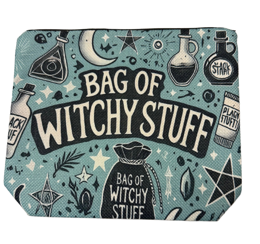 A square zippered pouch with a light blue-green canvas texture, featuring a black and cream graphic print of a witch's bag, potion bottles, stars, and the text 'BAG OF WITCHY STUFF'.