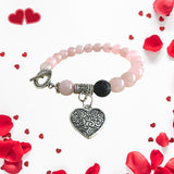 Rose Quartz essential oil diffuser bracelet with heart charm.