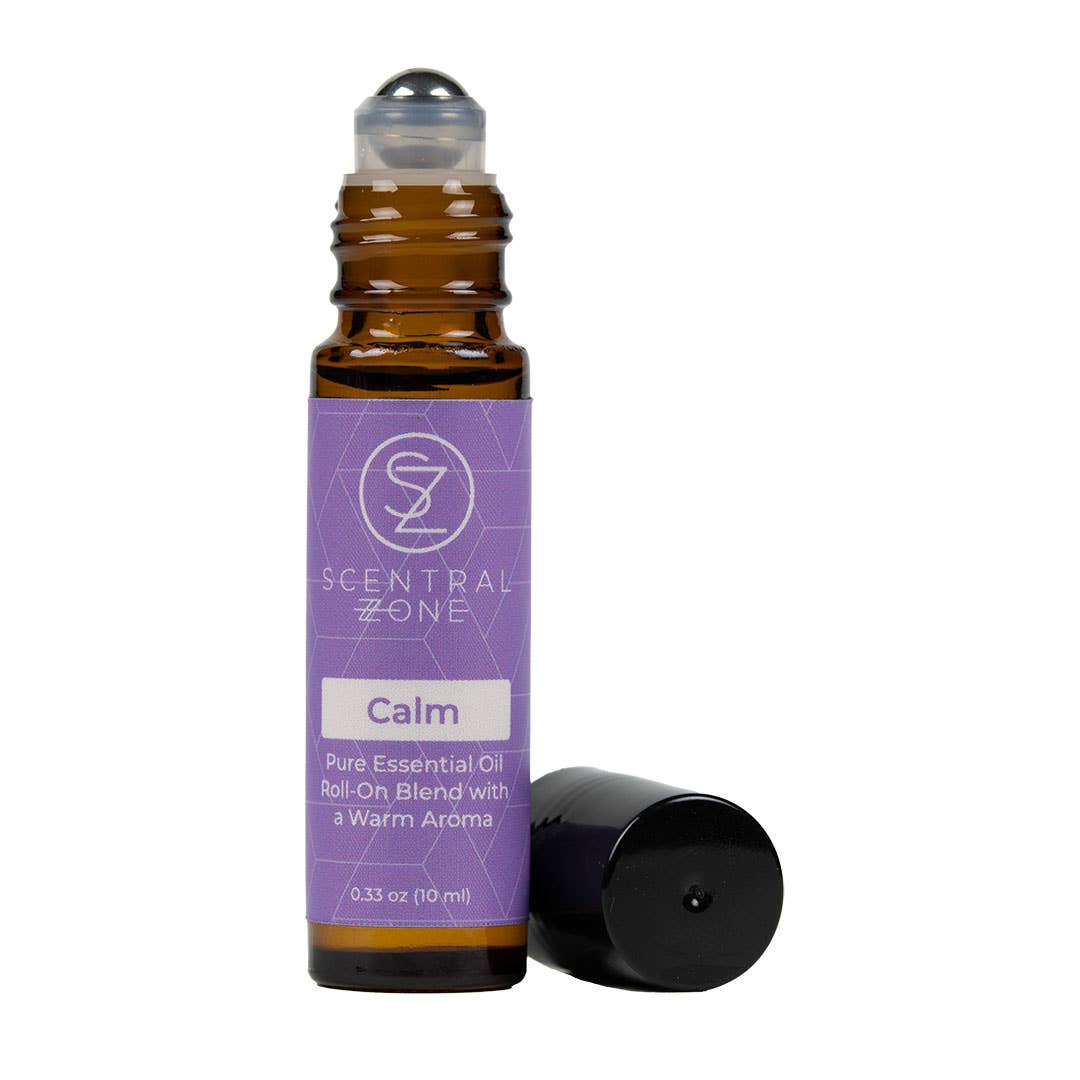 Roll-on essential oil bottle with purple label on a white background