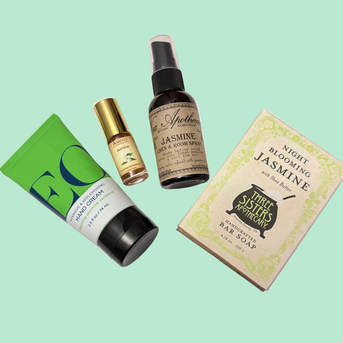jasmine gift set flay layout of soap, hand cream, perfume and spray mist.